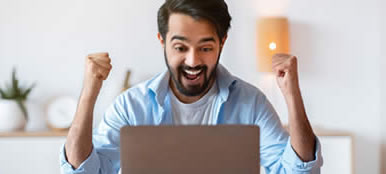 excited guy with a new website for his business